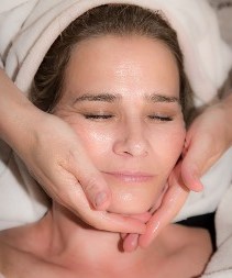 Palm Springs CA esthetician applying facial moisturizer